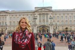 Student posing for portrait outside Buckingham palace